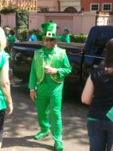 One of the marching club members decked out in green